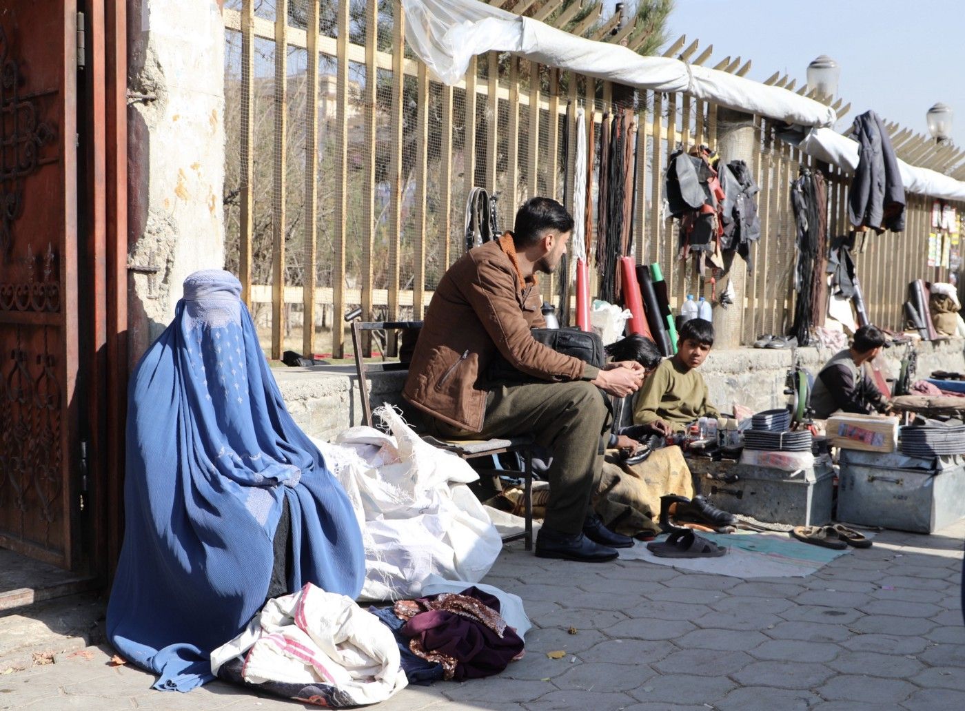Afghan Sells Family’s Clothes to Feed Her Children