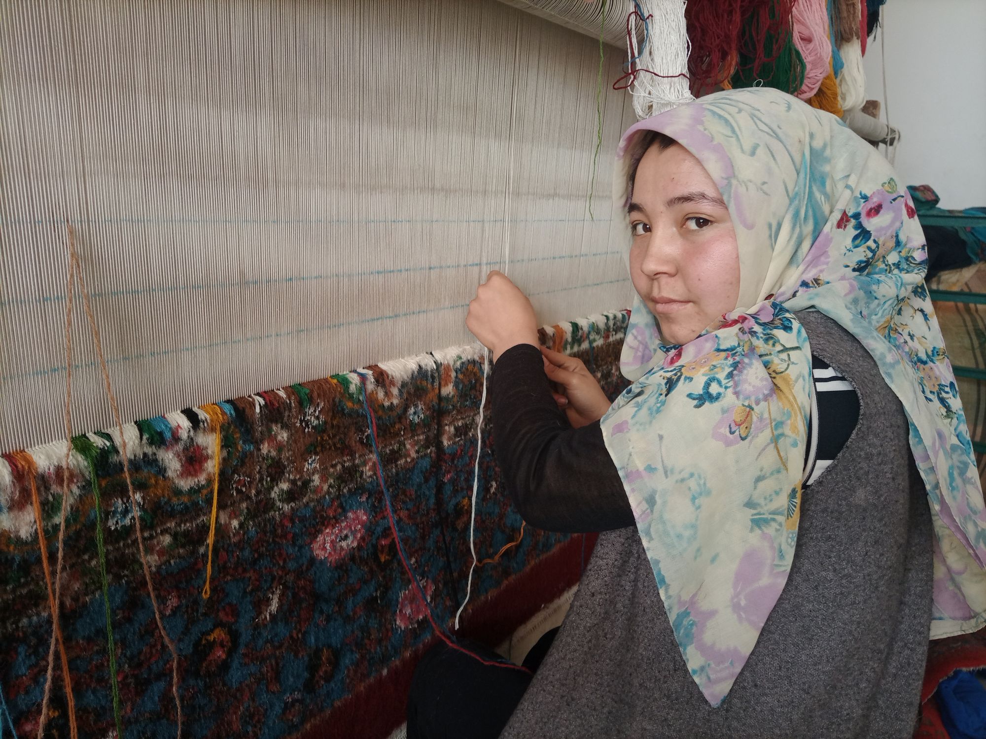 Young Carpet Weaver Makes Beautiful Designs